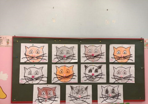 Prace dzieci z grupy 1. Koty pomalowane kredkami, wąsy wykonane z bibuły.